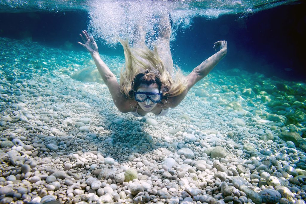 snorkeling-in-the-tropical-sea-woman-with-mask-min